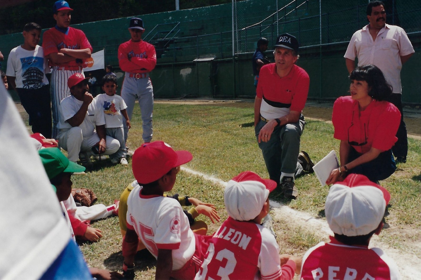 Tom Farrell coaching baseball with kids in Venezuela